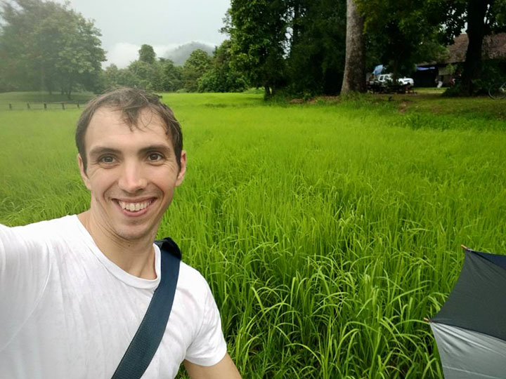 Isaac in a rice field.